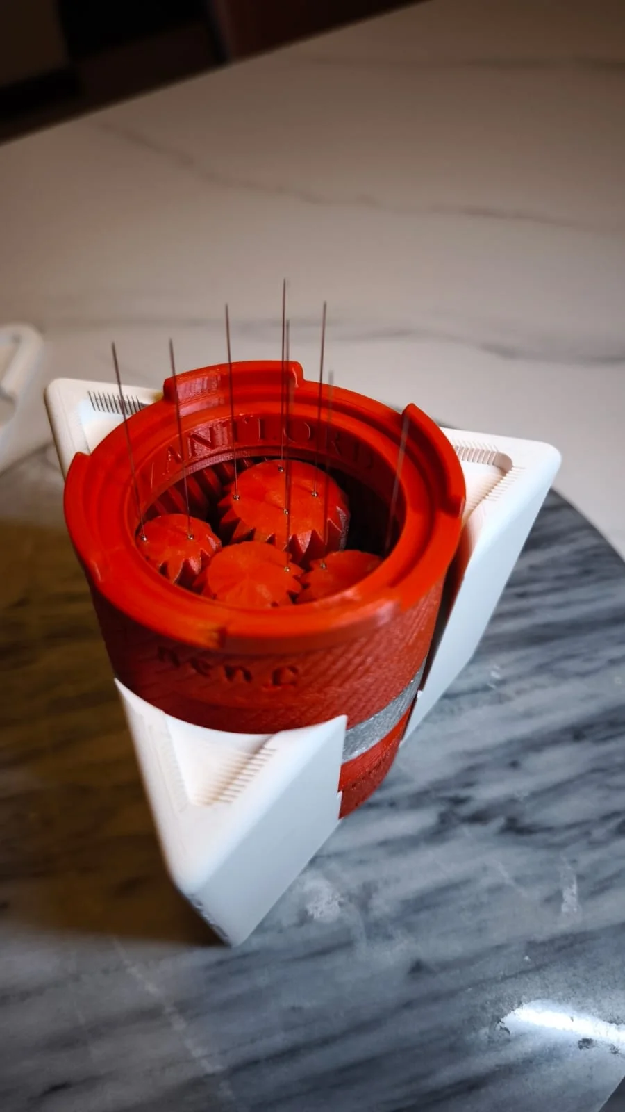 Close view of the Avantlord WDT needle array above the exposed gear mechanism.